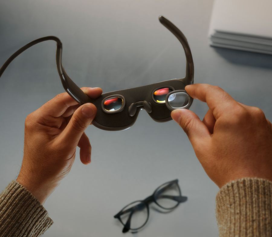 Person holding Meta VR Glasses showing the lenses