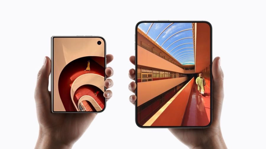 Hands holding the iPhone Duo closed and fully unfolded