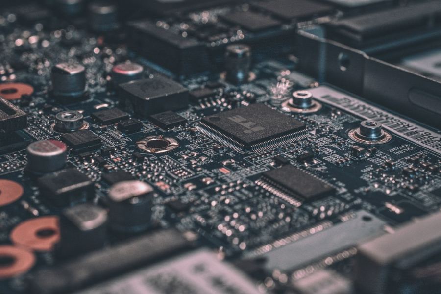 Circuit board detail representing the layered complexity of modern AI and software systems